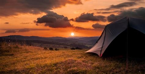 Premium Photo | Tourist tent in the mountains under dramatic evening ...