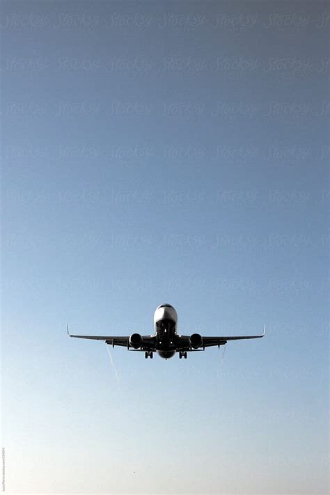 "Commercial Airplane Landing" by Stocksy Contributor "Sky-Blue Creative" - Stocksy