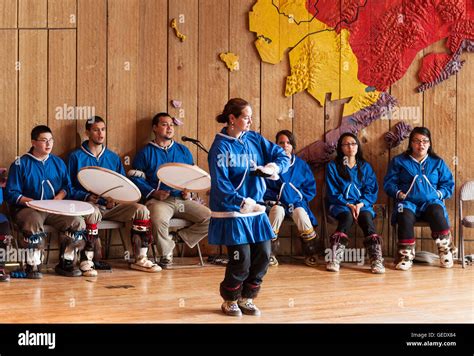 Native Alaskan youth demonstrates the traditional dance of her culture ...