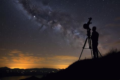 Premium AI Image | A stargazer perches on a hill his telescope pointed ...