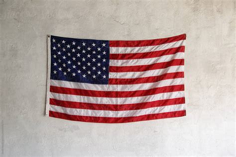 USA flag hanging on wall. Fourth of July by Danil Nevsky - Stocksy United