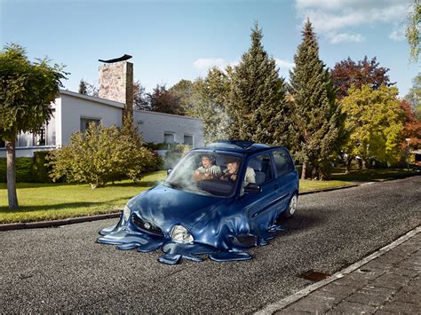 surreal scenes show melting cars disappear into suburban streets