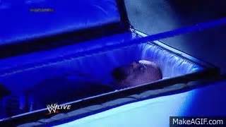 Undertaker rises from a coffin to attack Brock Lesnar: Raw, March 24 ...