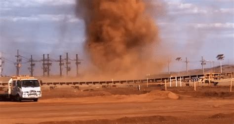 Red Dust Devil Swirls Through Outback Mining Camp