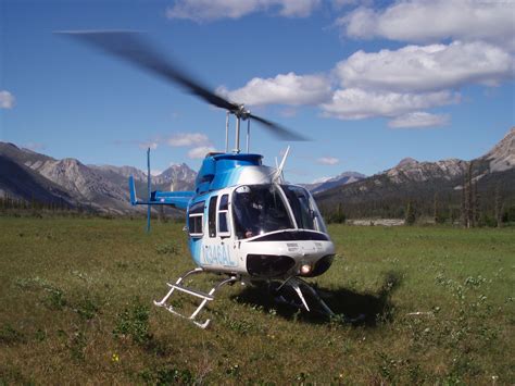 Taking a break in one of the company's Bell 206L3s on the Chandalar River drainage, during a ...