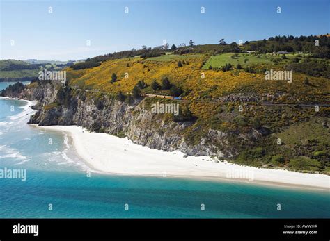 Seasider Train above Cliffs at Doctors Point near Dunedin South Island New Zealand aerial Stock ...