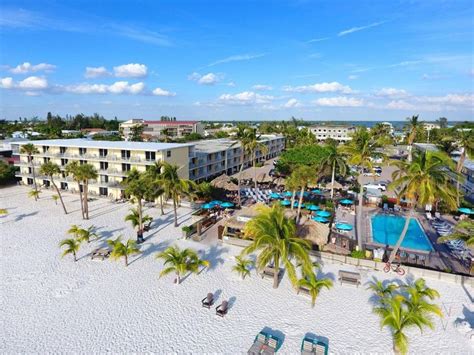 an aerial view of the resort and beach