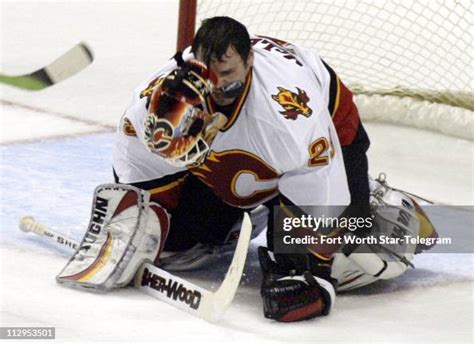 Calgary Flames goalie Jamie McLennan loses his face mask after... News ...