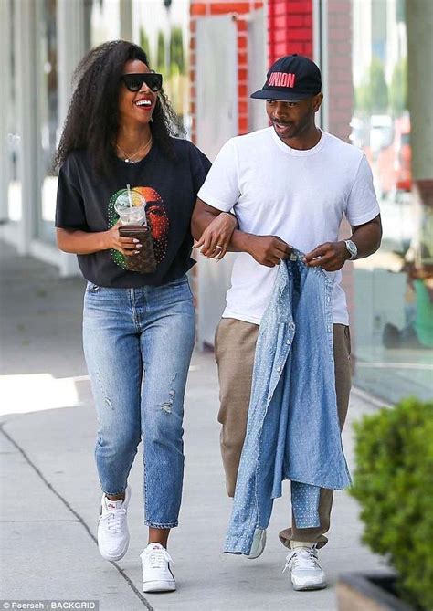 Kelly Rowland can't stop smiling as she lovingly strolls arm-in-arm ...