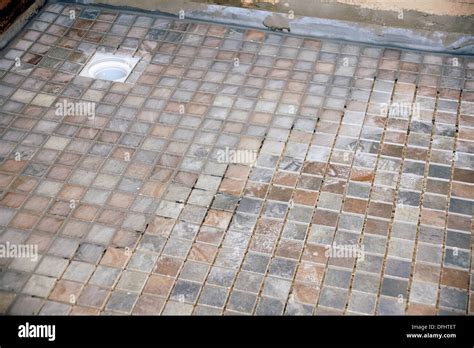 Non slip tiles used for the flooring in a wet room (shower bathroom Stock Photo: 61243360 - Alamy