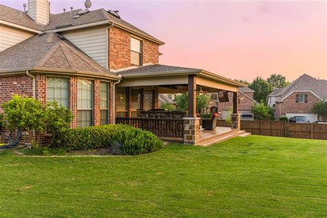 Hip roof patio cover attached to the house with small summer kitchen ...