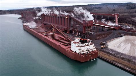 The 1000' "Mesabi Miner" takes on taconite pellets at the Cleveland Cliffs iron ore facility in ...