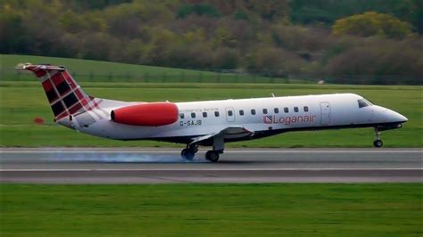 FIRST Loganair Embraer ERJ-135 GUSTY Landing at Manchester Airport! - YouTube