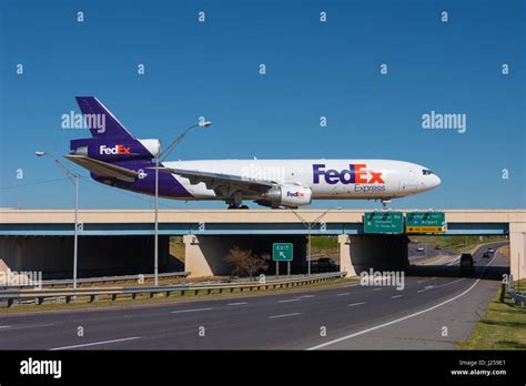 FedEx jet on taxiway bridge over terminal access road at Memphis ...