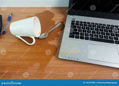 Coffee Cup Spill Out on Keyboard Laptop Computer and Smartphone on Wooden Floor Stock Photo ...