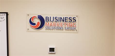 Company logo printed and applied to clear acrylic and mounted to the ...