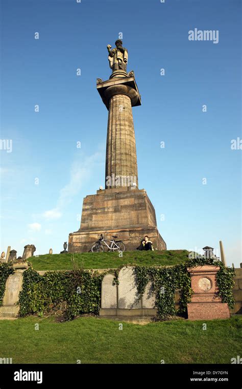 John Knox Statue on top of a 58 ft (17.78m) sandstone column in the Necropolis Glasgow Stock ...