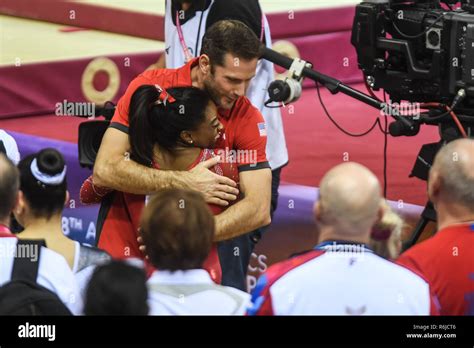 Doha, Qatar. 3rd Nov, 2018. SIMONE BILES hugs her coach LAURENT LANDI ...