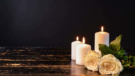 Download White Candles And Roses On A Wooden Table | Wallpapers.com