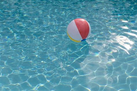 Premium Photo | Colorful inflatable ball floating in the pool