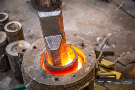 Metal ware heating in crucible — indoors, skill - Stock Photo | #250675256