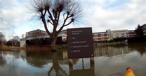 River Thames flooding - canoeist takes to the water at Runnymede ...