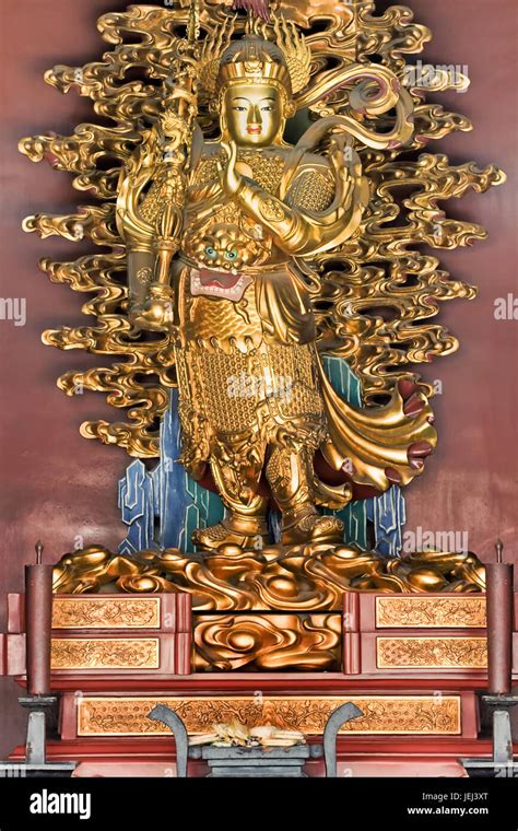 Golden statue on an altar at Lama Temple, Beijing Stock Photo - Alamy