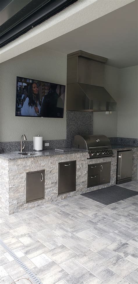 Enjoy a TV with Your Summer Kitchen - Elegant Outdoor Kitchens