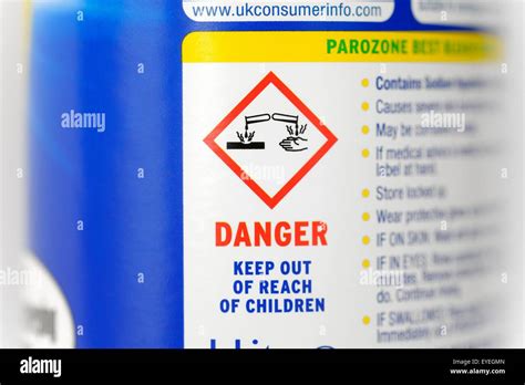 Caustic warning symbol on a bottle of bleach Stock Photo: 85757637 - Alamy