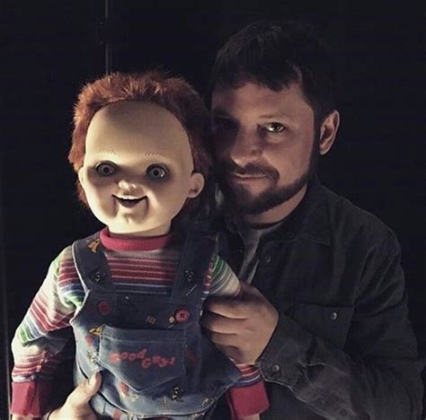 Alex Vincent who plays Andy Barkley in the "Child's Play" movies holding Chucky in the new "Cult ...