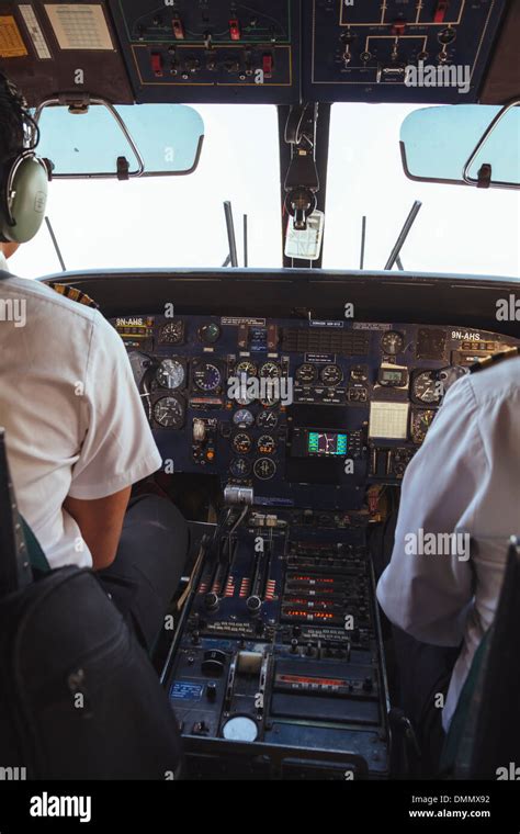 Two pilots in the cockpit of a Dornier 228 Stock Photo - Alamy