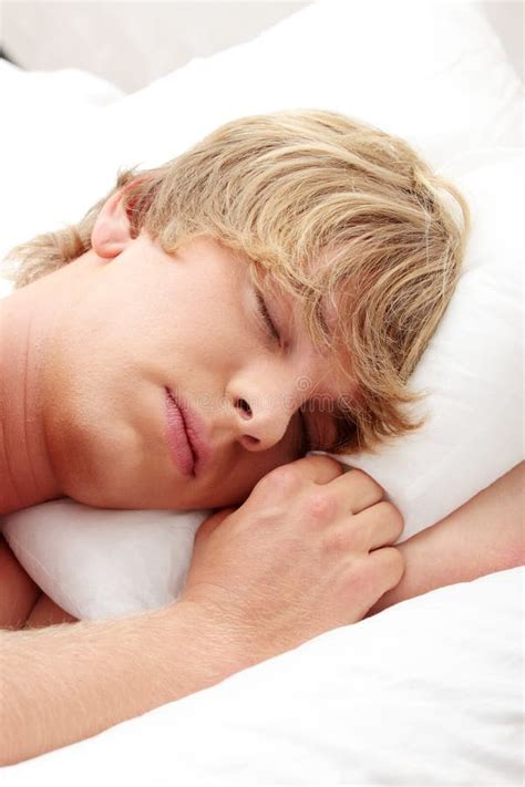 Man sleeping in his bed stock photo. Image of comfortable - 16312132