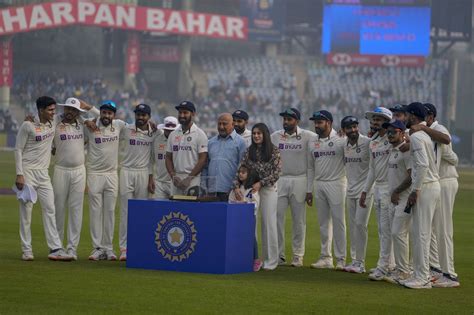 Cheteshwar Pujara poses for a picture with family and team-mates | ESPNcricinfo.com