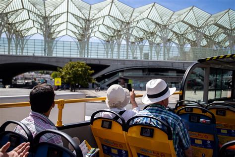 Discover Lisbon by bus, historical tramcar and a river Tagus cruise