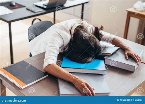 Tired Female Student Sleeping on Desk Face and Hands on Books Stock Photo - Image of laziness ...