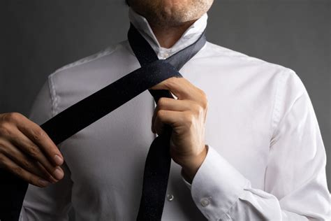 How to Tie a Four In Hand Knot (Step-By-Step Guide) - The Modest Man