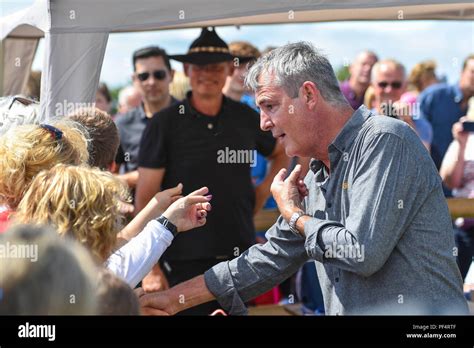 Beaminster, Dorset, UK. 19th August 2018. UK Weather. Actor Neil Morrissey with his friend actor ...