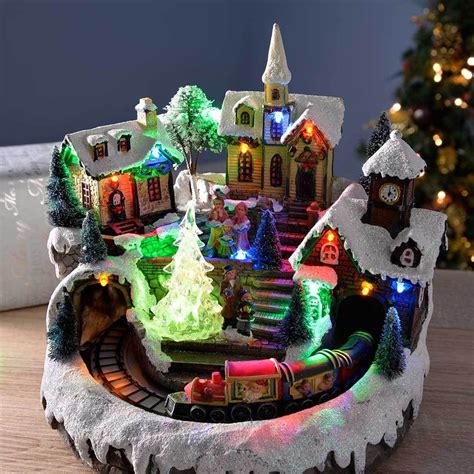 Pre-Lit LED Musical Animated Christmas Village Scene with Rotating Train, 23 cm | Animated ...