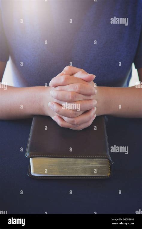 Teen praying with holy bible hi-res stock photography and images - Alamy