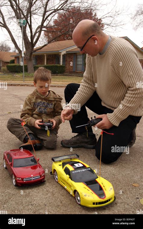 father and son racing remote control cars Stock Photo - Alamy