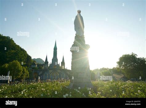 Sunset at Sanctuaires Notre-Dame de Lourdes, a Catholic pilgrimage site ...