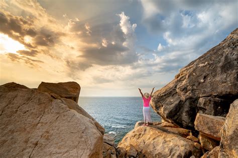 Person Standing on Mountain · Free Stock Photo