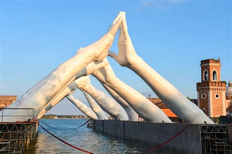 An incredible sculpture of human hands has been unveiled in Venice - Lonely Planet