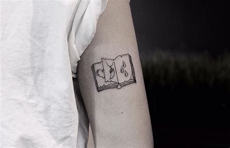 Small open book tattoo - Tattoogrid.net