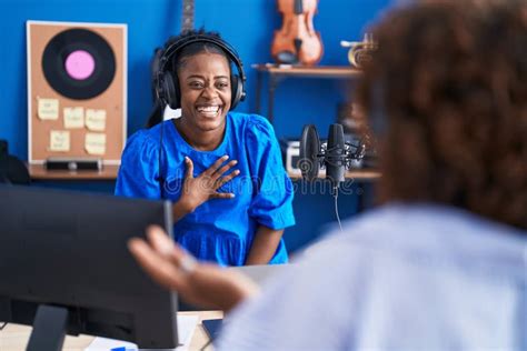 African American Women Musicians Smiling Confident Speaking at Music Studio Stock Photo - Image ...