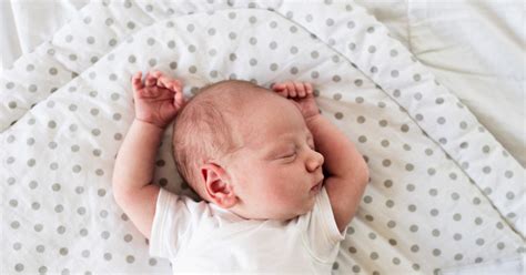 Why Do Babies Sleep With Their Hands Up In The Air? This Position Has The Cutest Name