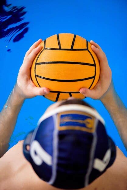 Premium Photo | Water polo training young sportsman plays water polo in ...