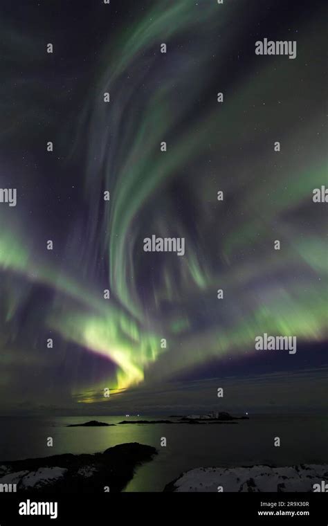 Northern Lights (Aurora borealis) in green and pink over the North Sea ...