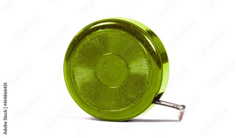 Old scratched green metal tape measure Stock Photo | Adobe Stock