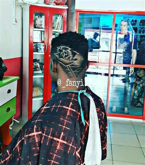 Photos: Talented Nigerian Barber Fanyi Designs Fela, Wizkid And Davido’s Faces On Clients Head ...